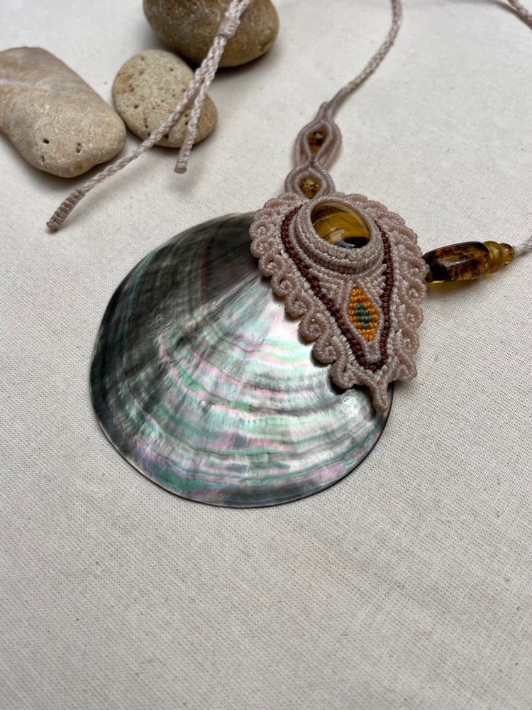 Image of macrame necklace with tigers eye and mother of pearl shell 