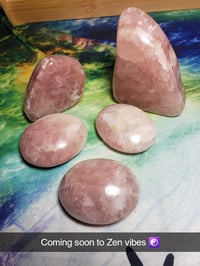 Rose calcite palm stone