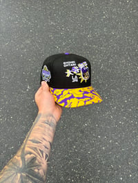 Image 1 of  PURPLE VISOR BLACK OHTANI LOS ANGELES DODGERS CUSTOM FITTED CAP