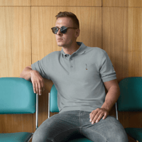 Image 3 of MamaFe's Black Font Mustard Seed Front, Logo Sleeve Men's Premium Polo
