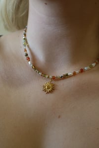 Image 1 of Green and Orange Sun