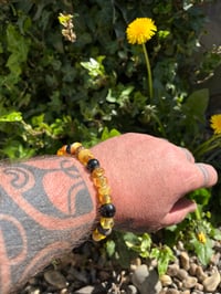 Image 3 of Amber and Jet mixed beads. 