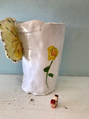 Image of Greenhouse garden  beaker, butterfly  handle