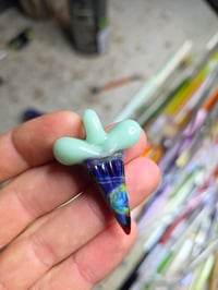 Image 1 of Glass shark tooth pendant.