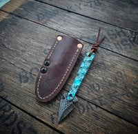 BROKEN ARROW • turquoise trustone with black web/ brass pin