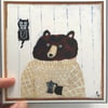 Small square print featuring a bear with coffee