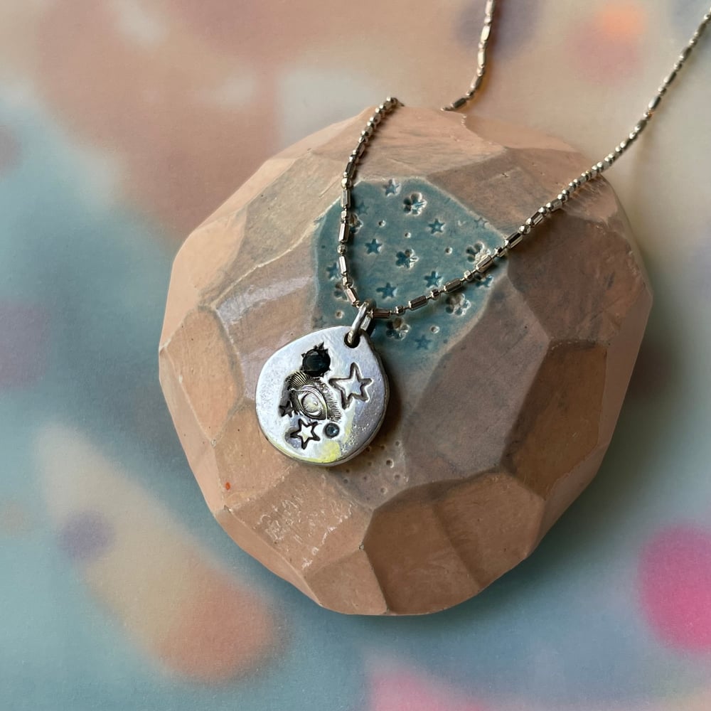 Image of eye and stars necklace