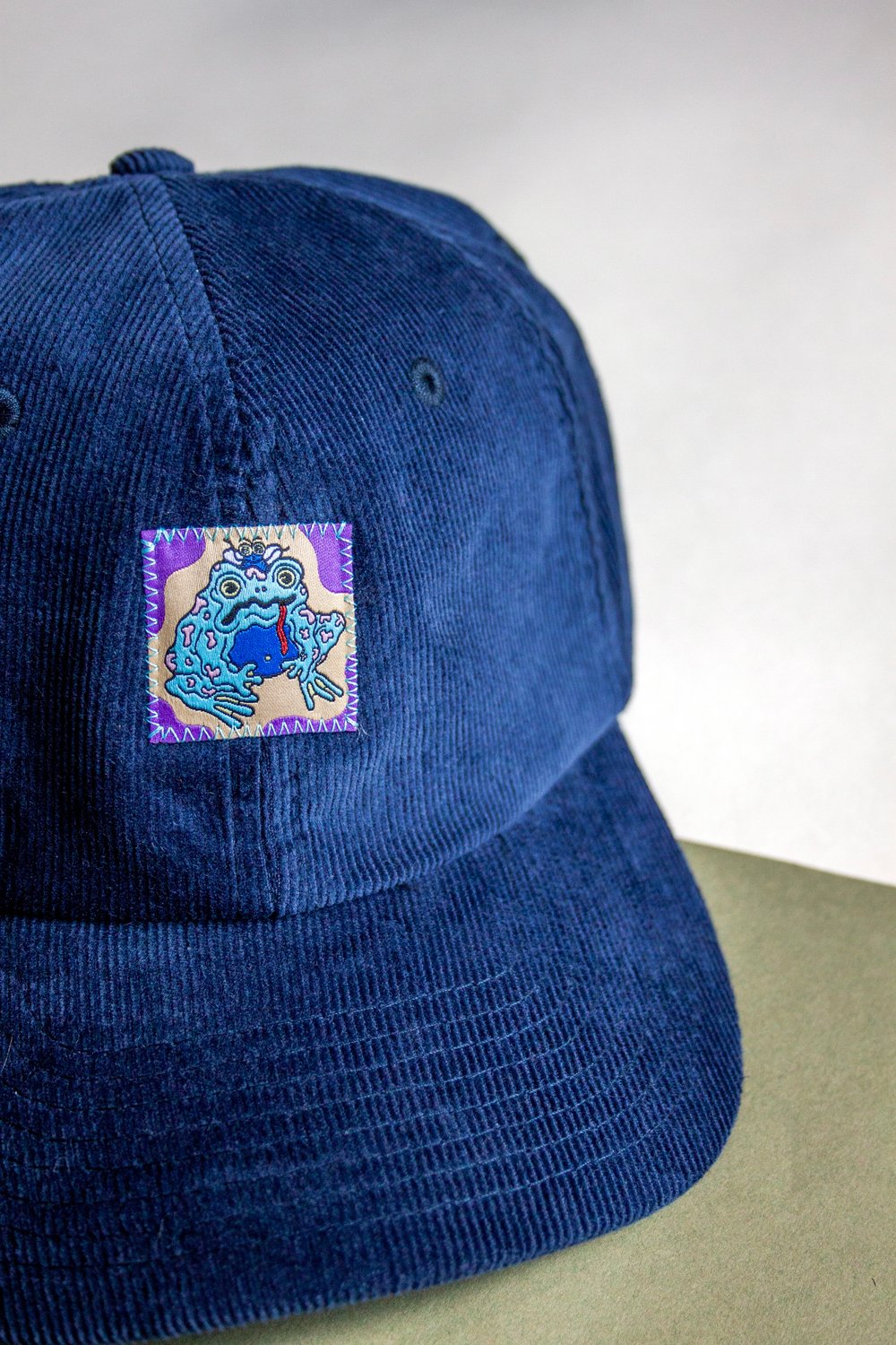 Image of Navy Psychedelic Frog Cord Cap