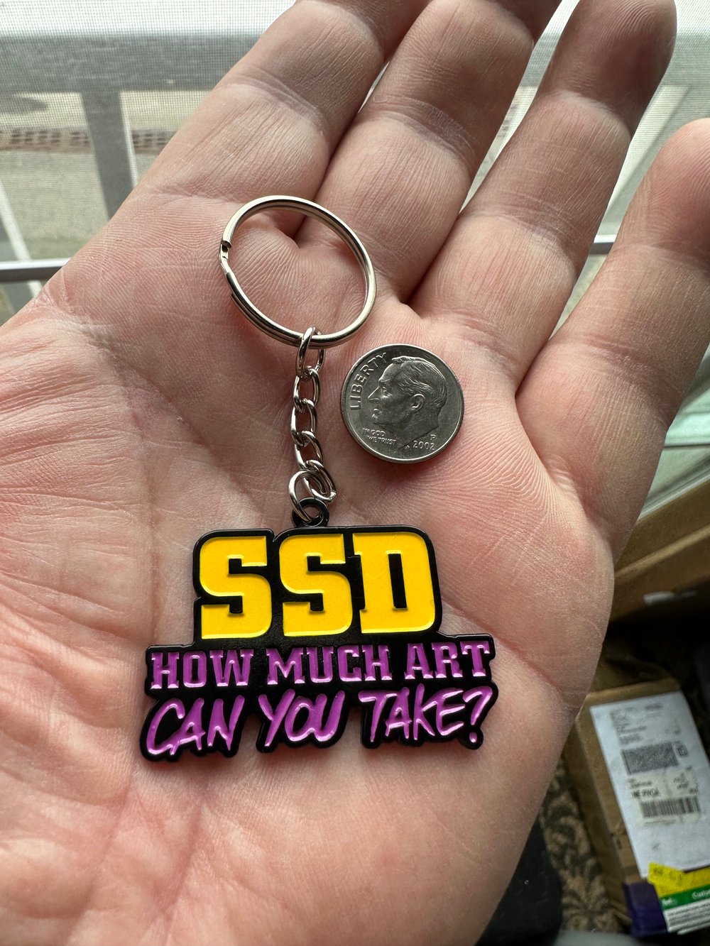 SSD “How Much Art” metal keychain 