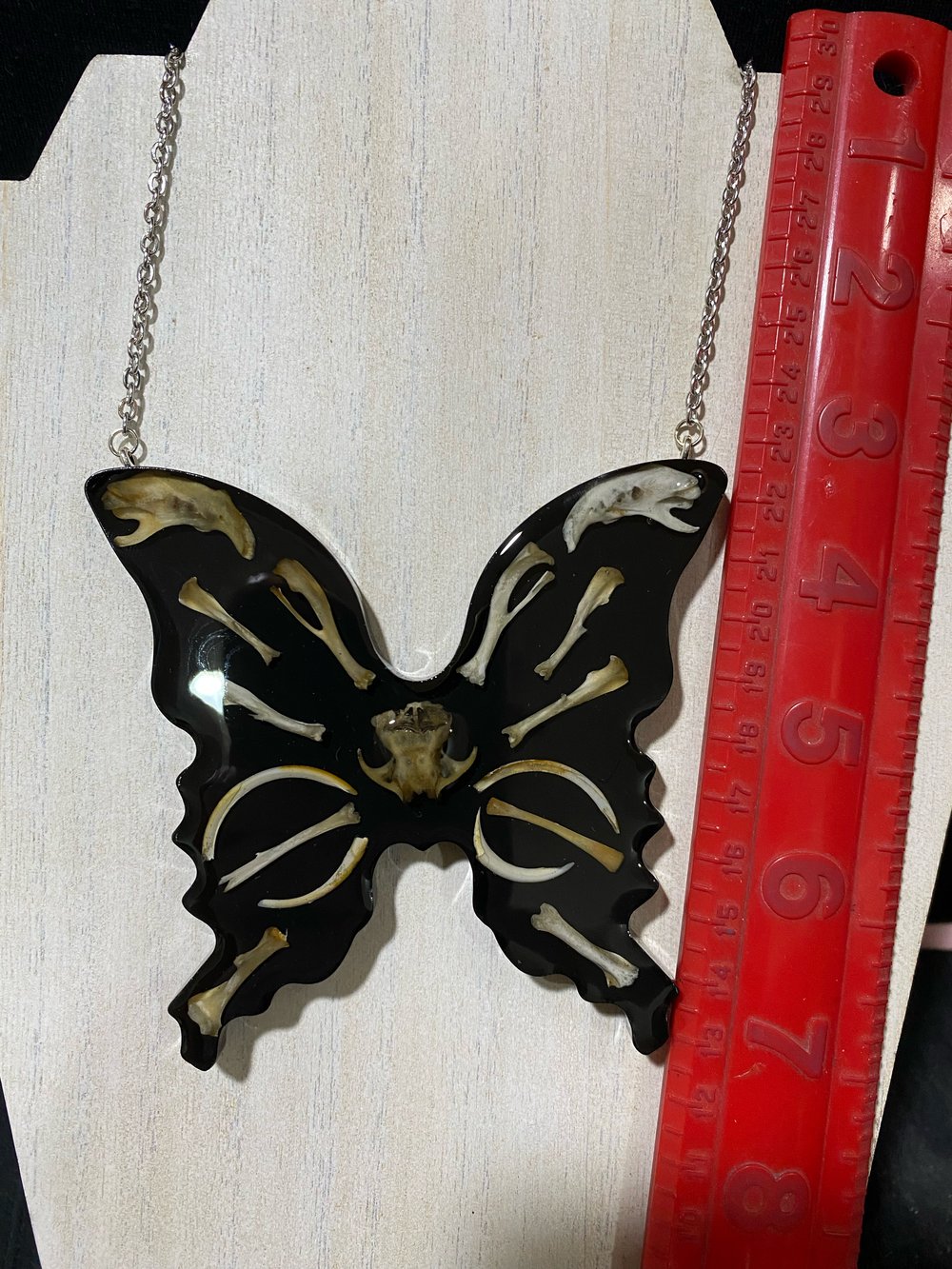 Skull and bone butterfly pendant 