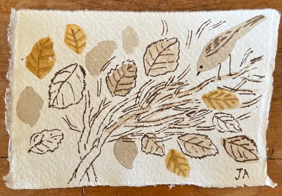 Image of Sparrow in a beech hedge 