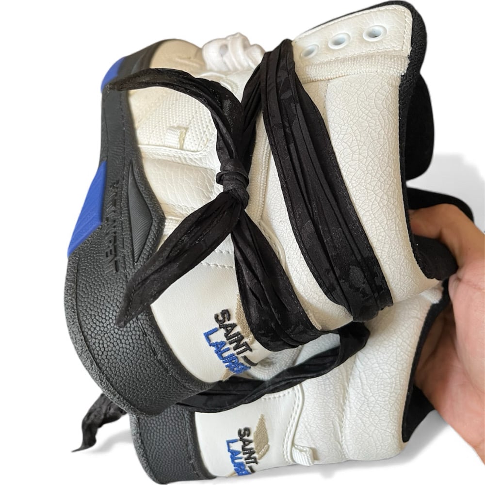 Image of Saint Laurent Cure Leather Trainers