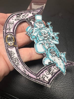 Image of 9” Haunted Mansion Disneyland “D” 1969 patch with iron on backing