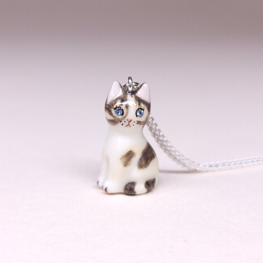 Image of Dilute Calico Porcelain & Sterling Silver Sitting Kitten Pendant