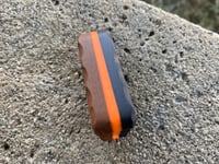 Image 2 of Orange and black g10 , orange glow center , purple valley carbon with chip cut