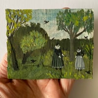 Two figures in a spring garden with trees