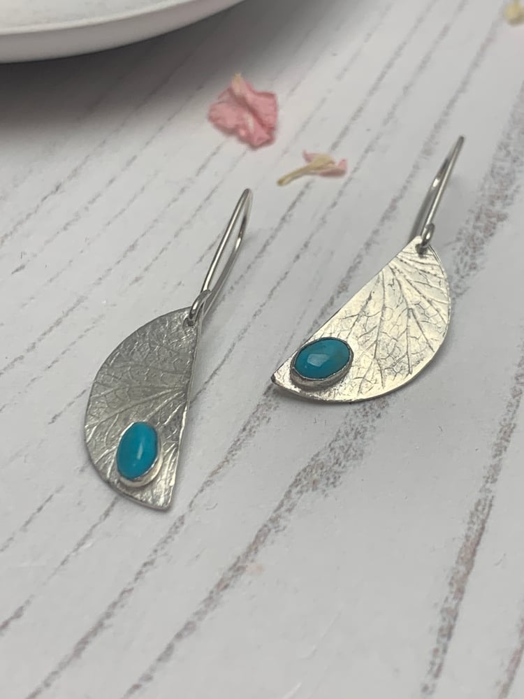 Image of Recycled silver half moon dangly earrings with turquoise stones. 