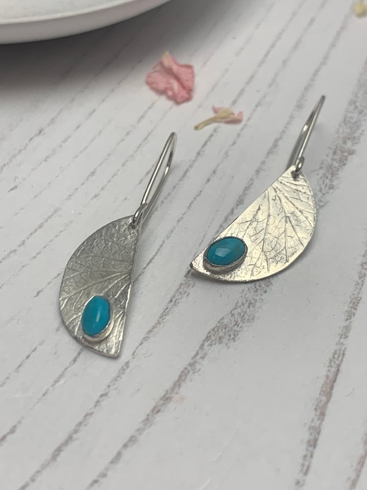 Image of Recycled silver half moon dangly earrings with turquoise stones.