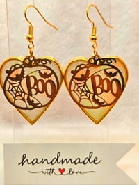 Image 1 of Handcrafted Resin Glow In The Dark Heart Shaped Pumkin " Boo" Earrings 