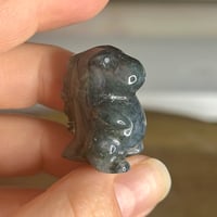 Image 1 of Moss Agate Chubby Dino ($9)