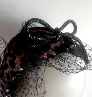 Image of Leopard fabric covered headpiece