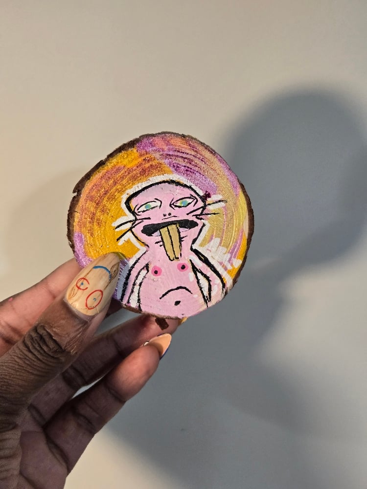 Image of Mole Man on a Wooden Slice