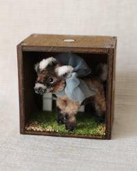 Image 1 of pipe cleaner Cocoa the dwarf goat
