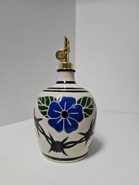 Image 1 of Oil Bottle 5 - Flowers & bared wire