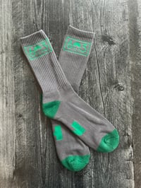 Image 1 of 603 green/grey socks with NH on the bottom