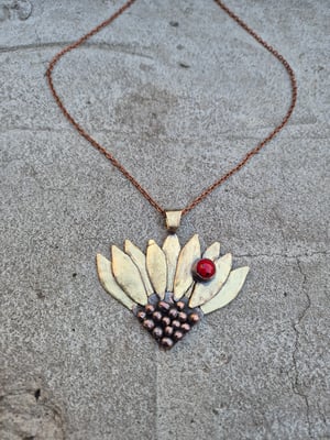 Sunflower pendant with ladybug 