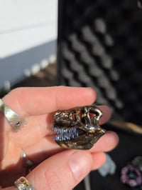 Image 5 of Mini electrum T-Rex skull pendant.