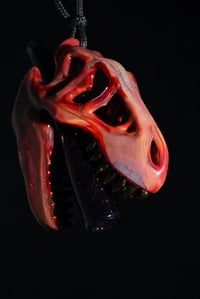 Image 1 of Wizard dust/dark ruby T-Rex skull pendant with ekectrum teeth & crushed opal tip