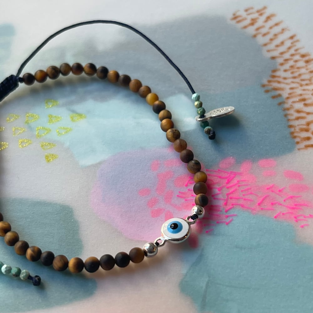 Image of tiger eye and charm bracelet