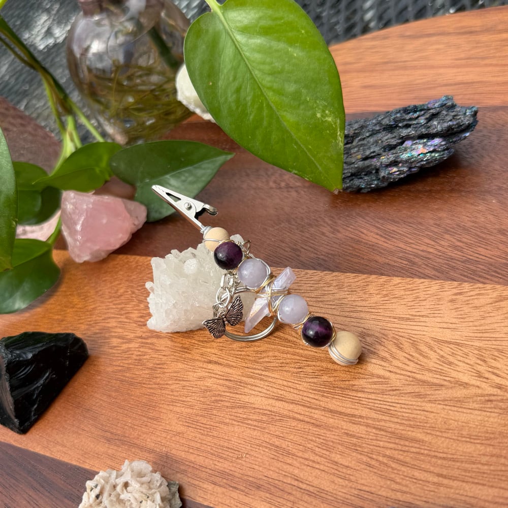 Image of purple pupa clip keychain
