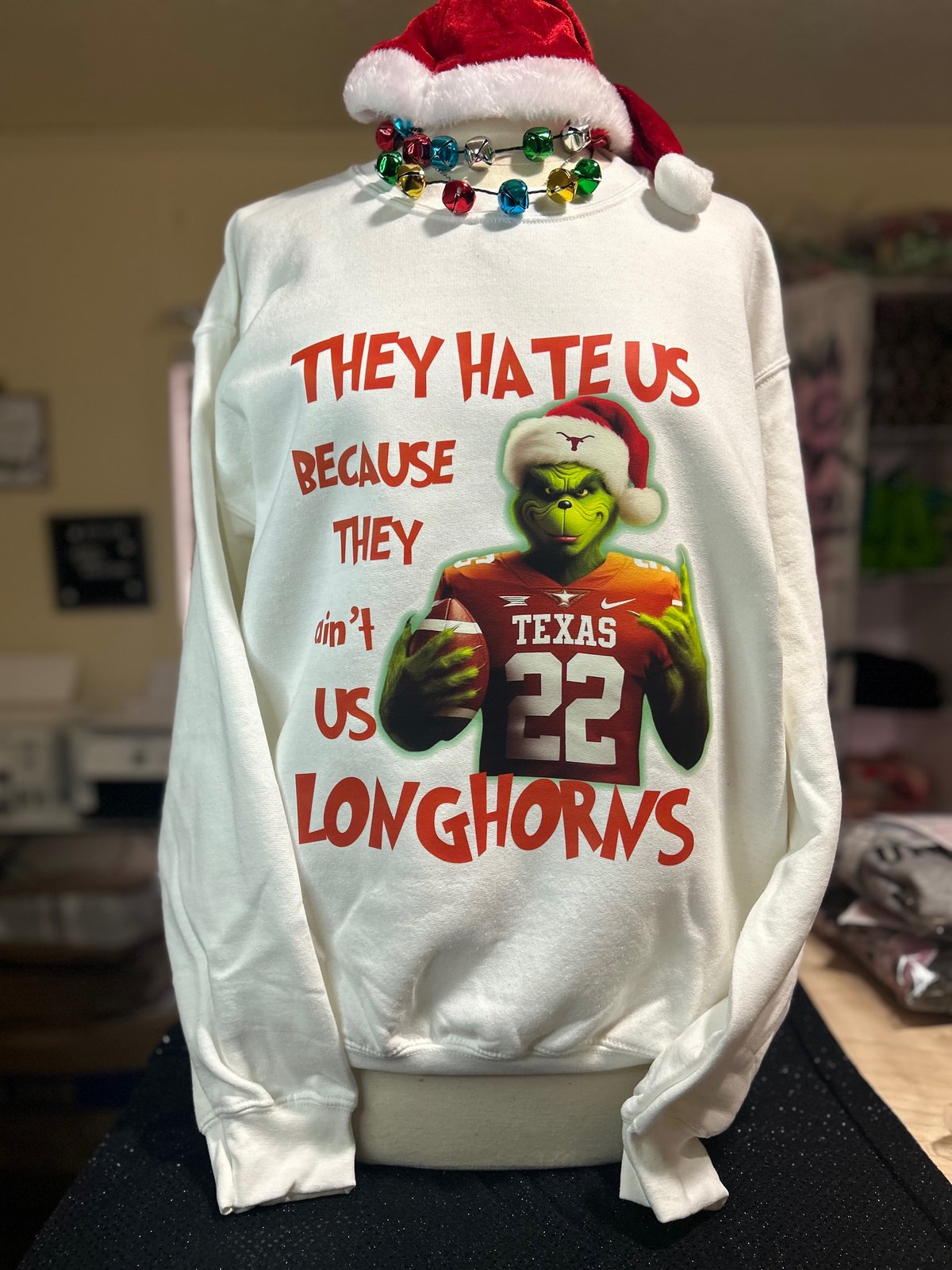 https://assets.bigcartel.com/product_images/a553ae6d-5b4e-4ecc-a03e-c4129cdbe5e2/grinch-longhorns-sweater.jpg?auto=format&fit=max