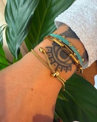 Image 3 of JADE Hand-Woven Turquoise Cotton Bracelet with Gold Bead Detail 