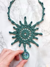 Image 1 of crochet sun necklace with carved labradorite eye
