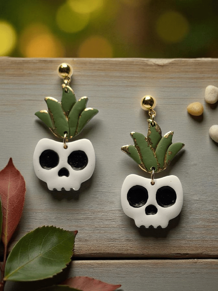Image of Creep It Growing Earrings - Glow in the Dark Skull Plant Jewelry