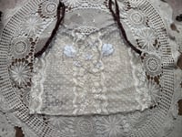 Image 3 of white lace with flowers