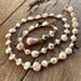 Image of Dainty Hawaiian puka shell wrap bracelet or necklace  with a Tahitian pearl and a pink cone shell