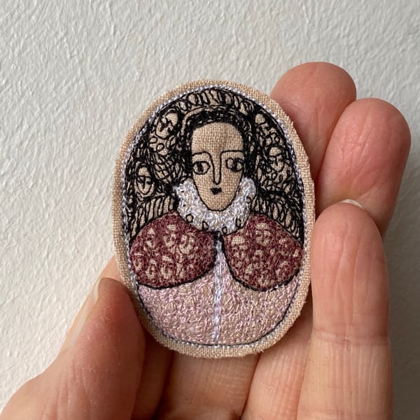 Image of smaller portrait of a noble figure in pale pink