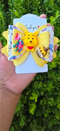 Image 1 of Winnie pooh bow