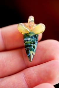 Image 1 of micro mixed color glass shark tooth pendant. 