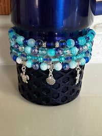 Image 1 of Star Shine Sea Glass Aura Blue and Teal Tumbler Bracelet Stack