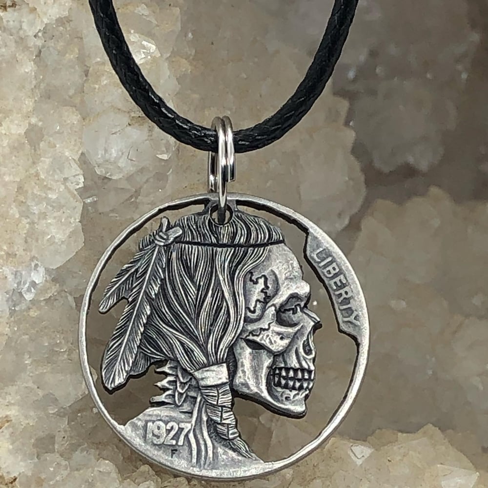Image of Sawed out detailed skull nickel 