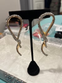 silver and gold bow earring 