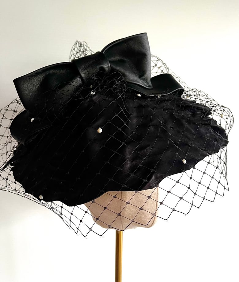 Image of Black leather saucer headpiece