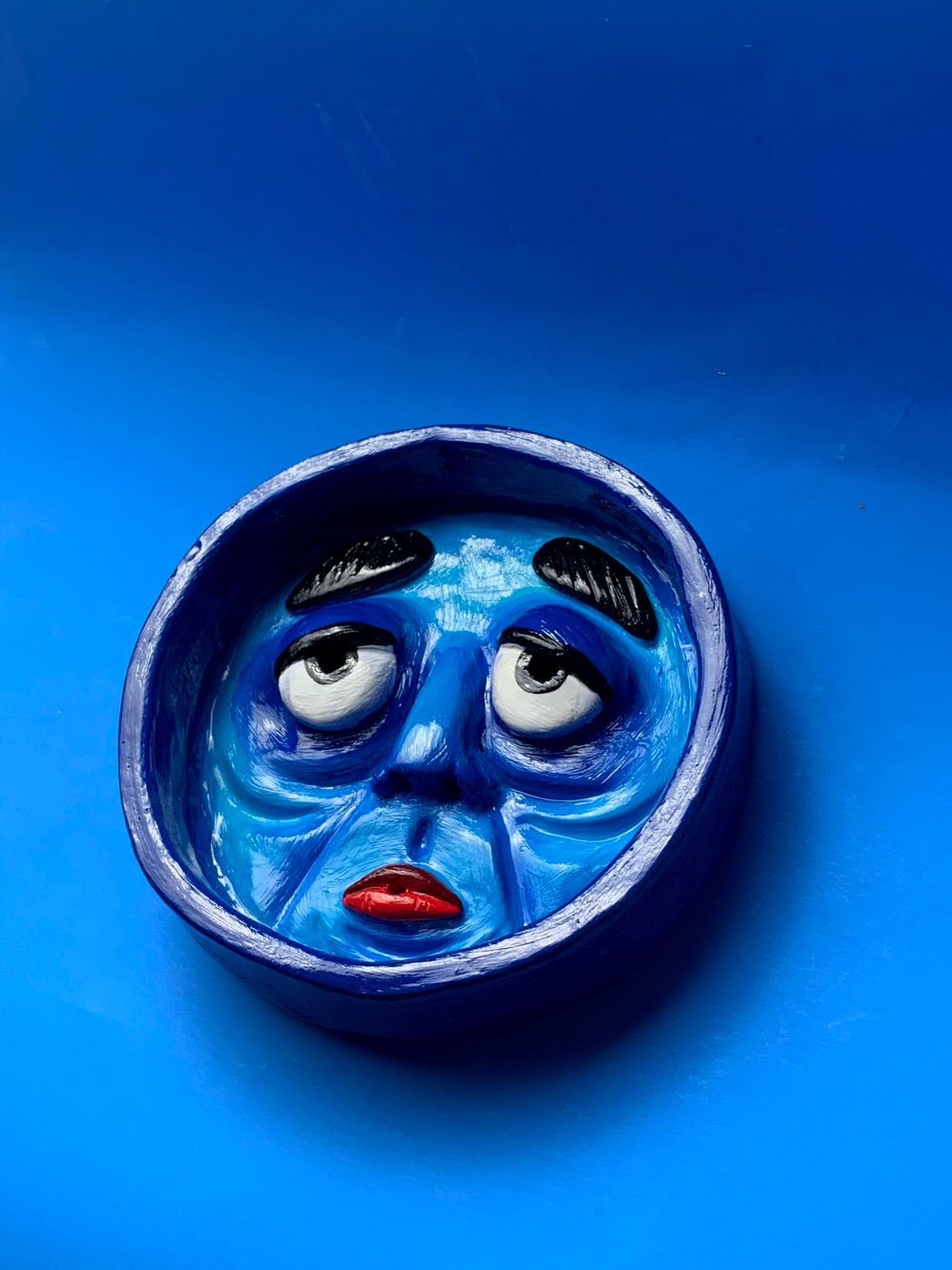 Sad blue guy incense holder