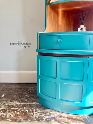 Image of Nathan Corner Drinks Cabinet unit with light in vibrant teal