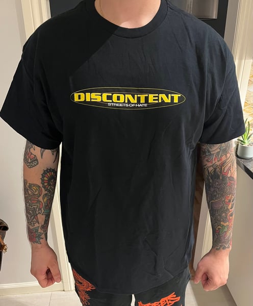 Image of Discontent Yellow Oval Logo Tee